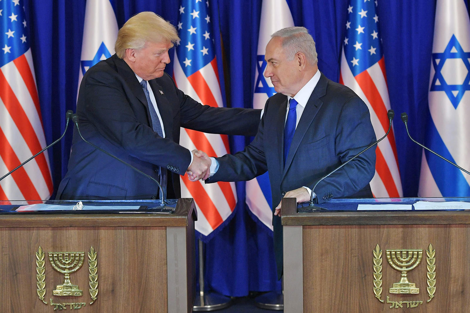 US President Donald Trump (L) and Israel's Prime Minister Benjamin Netanyahu shake hands after delivering press statements before an official diner in Jerusalem on May 22, 2017. / AFP PHOTO / MANDEL NGANMANDEL NGAN/AFP/Getty Images